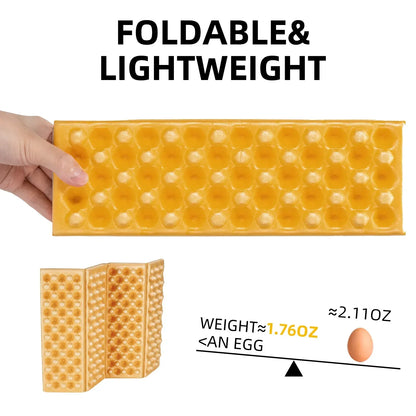Foldable and lightweight ice cube tray with a hand holding it, showing its size compared to an egg.#color_Yellow