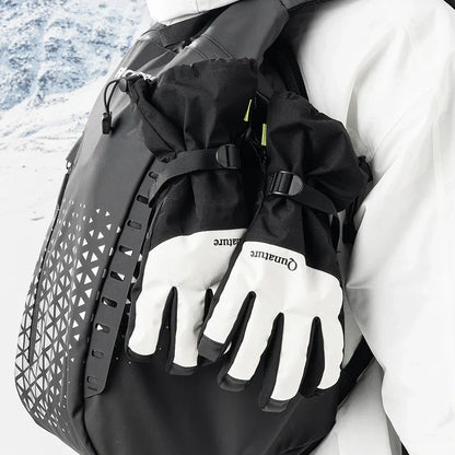 Person wearing black gloves and a backpack with a scenic background