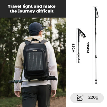 Person wearing a black backpack with solar panel, hiking pole, and measurement details on a white background.#color_black